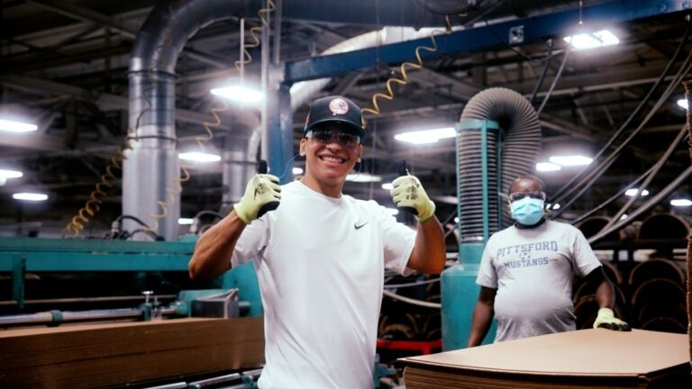 Smiling Worker at a Manufacturing facility